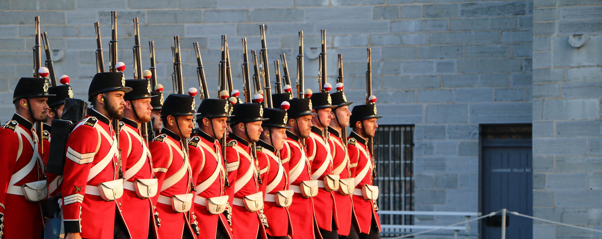 fort henry guard in red British uniforms marching